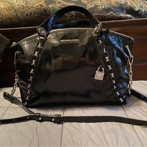 Barely used black pattern leather Michaels Khors bag